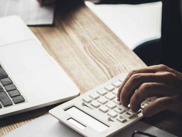 cropped shot of accountant using calculator